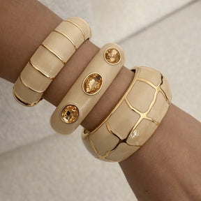 Bracelete Esmaltado Dourado com Pedras