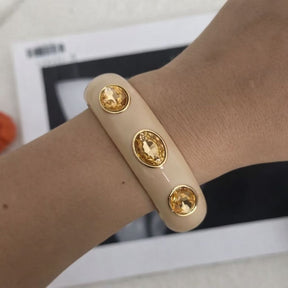 Bracelete Esmaltado Dourado com Pedras